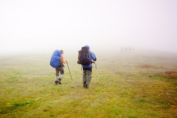 Hiking in Carpathian mountains in clouds