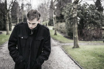 Lonely upset or depressed man outdoors