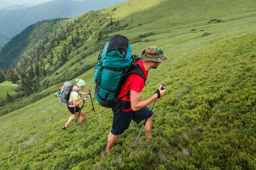 Fototapeta na wymiar Young people are hiking in Carpathian mountains in summertime