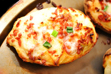 Twice Baked Potato with Cheesy Bacon on a Baking Pan