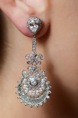 Female ear  in jewelry earrings
