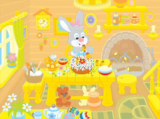 Obraz premium Easter bunny cooks a holiday cake