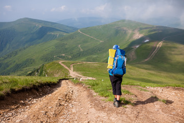 Fototapeta premium Young people are hiking in Carpathian mountains in summertime