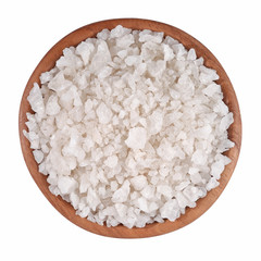 Sea salt in a wooden bowl on a white