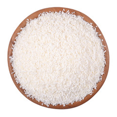 Shredded coconut in a wooden bowl on a white