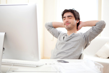 Young man relaxing during a break at the office