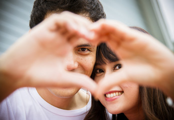 Lovely couple with love hand sign