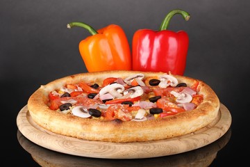 Aromatic pizza with vegetables isolated on black