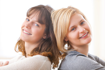 Best friends sitting on a sofa