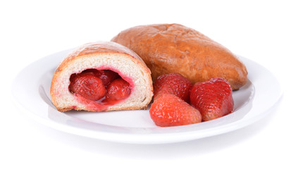 Fresh baked pasties with strawberries isolated on white