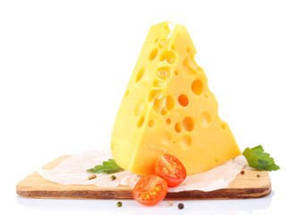 Piece of cheese and tomatoes, on wooden board, isolated on