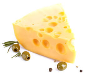 Piece of cheese with green olives, isolated on white