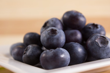 bilberries close on a white plate