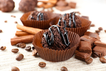 Delicious chocolates on table close-up