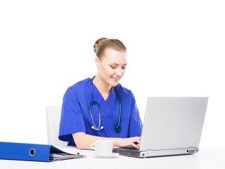 A cheerful female doctor working in an office