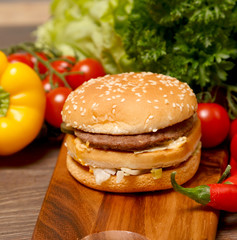 Grilled burger with three bread slices