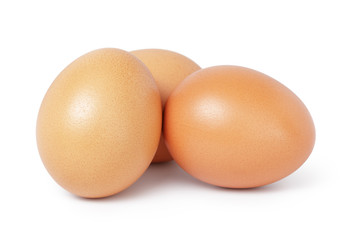 three brown chicken eggs