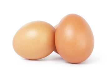 three brown chicken eggs
