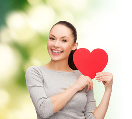 smiling asian woman with red heart