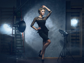 A woman in a fashion dress on a glamour background