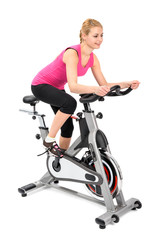 young woman doing indoor biking exercise