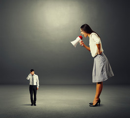 woman screaming at stressed businessman