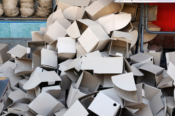 Many stack of paper boxes on footpath