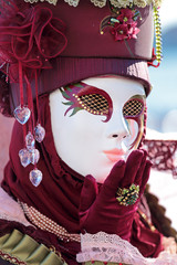 Red mask sending a kiss at Carnival of Venice