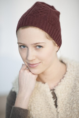 portrait of a beautiful young natural woman with a cap