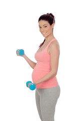 Pregnant woman doing exercise with dumbbells