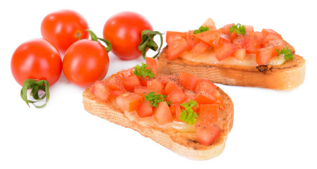 Delicious bruschetta with tomatoes isolated on white