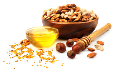 Sweet honey and different nuts, isolated on white