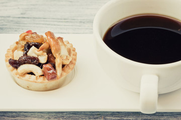 vintage black coffee and Fruit Tart  on wooden table