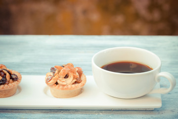 vintage black coffee and Fruit Tart  on wooden table