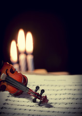 violin, music notes and candles