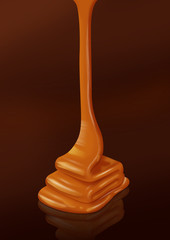 Caramel sauce on a dark background (clipping path)