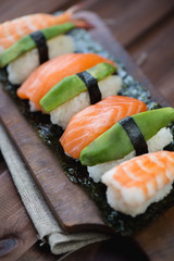 Close-up of sushi with salmon, shrimp and avocado