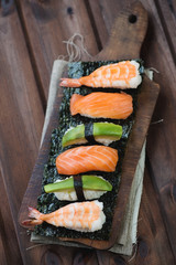 Sushi set on a rustic wooden background, studio shot