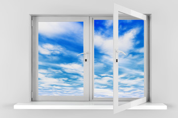 Fototapeta na wymiar Blue sky with clouds seen through opened plastic window