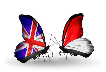 Two butterflies with flags UK and Indonesia or Monaco