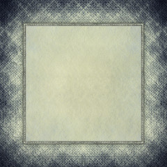 Paper sheet in picture frame on grunge background