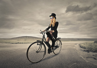 Fototapeta na wymiar cycling elegant girl