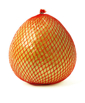 Pomelo fruit wrapped in red plastic reticle isolated on white