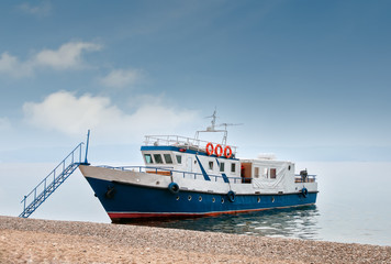 Naklejka premium Blue ship at the pier