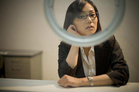 business woman sitting on chair in visiting room