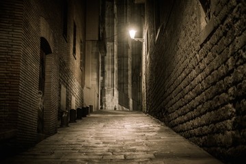 Empty street at night in Barri Gotic quarter in Barcelona, Spain