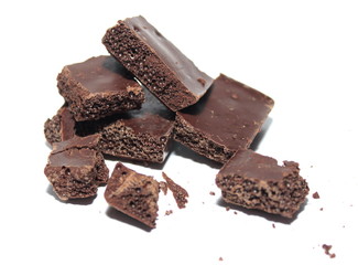 Broken chocolate bar on a white background