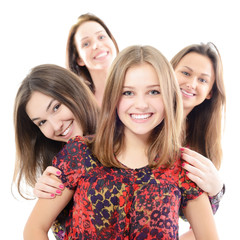 group of happy teen girls, over white background