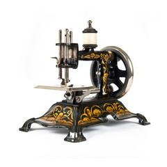 Retro sewing machine over isolated white background