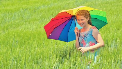 girl with umbrella on field